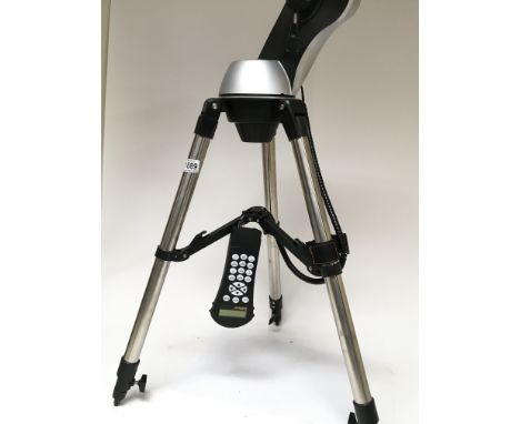 A Sky Scaner tripod with control panel for locating locations of stars and planets. (No telescope) and two boxes of lens and 