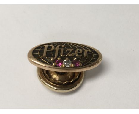 A gold tie stud marked 10 k 2.7 grams
