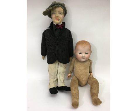 A German bisque headed doll and a male composite doll in Edwardian dress - NO RESERVE