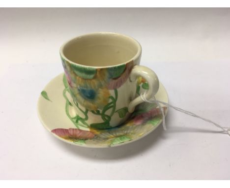 A Clarice Cliff cup and saucer decorated in the rodanthe pattern
