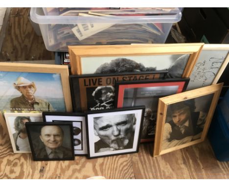 A collection of framed and unframed posters of musicians and actors including Bob Dylan, Sheryl Crow, Iggy Pop, Nick Cave, Ky