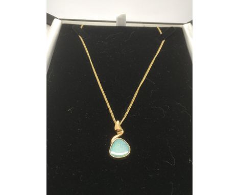 A 9ct gold chain with an opal pendant in a 9ct gold mount, approx 7.9g.