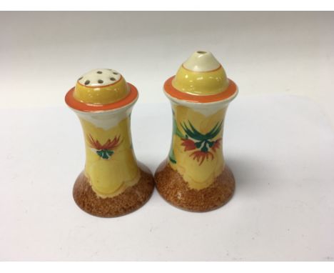 A pair of Clarice Cliff cruets decorated in the nasturtium pattern