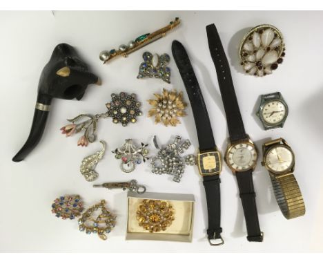 A small group of vintage brooches and watches plus a silver mounted wooden pipe formed as a bull