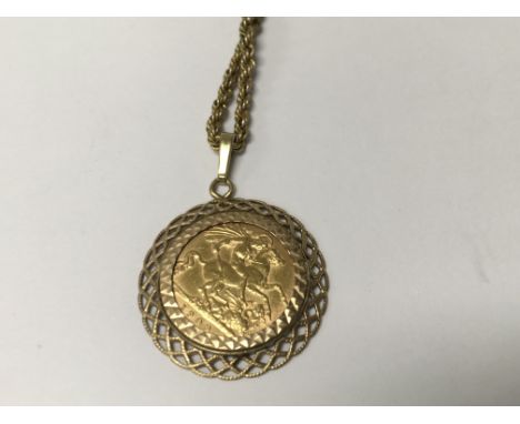 A 1909 half sovereign in mount with attached chain 9.9 grams