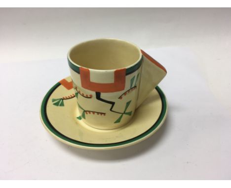 A Clarice Cliff coffee can and saucer decorated in a geometric pattern