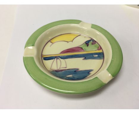 A Clarice Cliff ash tray decorated in the Gibraltar pattern