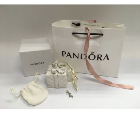 A genuine Pandora Christmas charm of a reindeer in a ceramic gift box, bag etc.