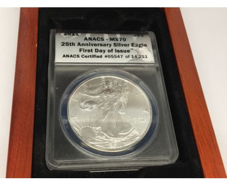 An American 25th Anniversary Silver (99.9) Eagle Dollar. First Day Issue. ANACS MS70 grade. Incased in plastic case and fitte