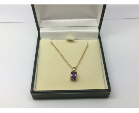 A 9ct gold chain with an amethyst pendant, approx 2.2g.