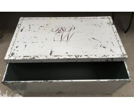 A vintage metal trunk with painted monogram to lid.Approx 50x89x46cm high