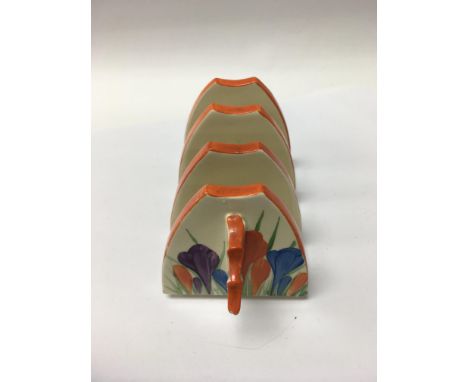 A Clarice Cliff toast rack decorated with the crocus pattern