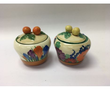 Two Clarice Cliff preserve jar and covers crocus and gay day