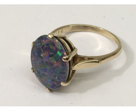 A 9ct gold, opal doublet ring.Approx size T