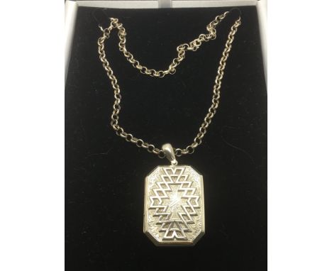 An antique silver locket on later chain, Chester hallmarks.
