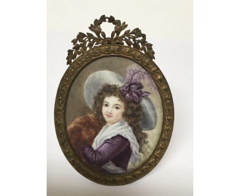 A Quality Early 20th Century Portrait miniature of a young lady with purple dress and fur hand warmer. The reverse with inscr