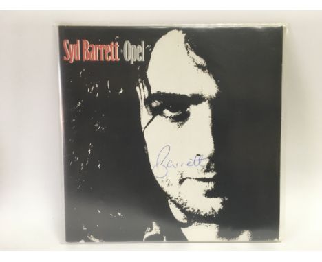 A near mint 1988 issue of the Syd Barrett 'Opel' LP. The cover has 'Barrett' inscribed to the front in blue ballpoint pen. Wh