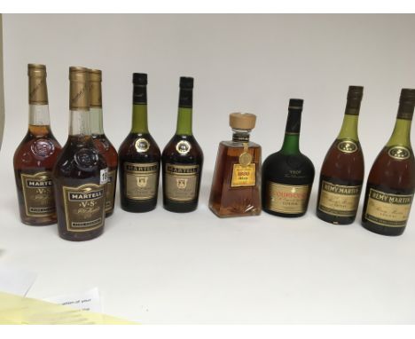 A collection of cognac three bottles of Martell V.S. Two other bottles of Martel, a bottle of Courvoisier two bottles of Remy