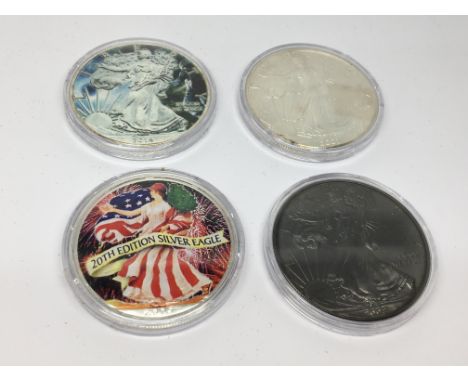 A Collection of Four American Silver Dollars enamel decorated.uncirculated US mint coins. Each One once of fine silver (9.99%