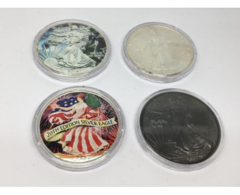 A Collection of Four American Silver Dollars enamel decorated.uncirculated US mint coins. Each One once of fine silver (9.99%