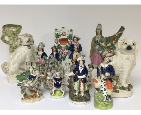 A collection of 19th century Staffordshire figures and a bisque figure and other ceramic figures.