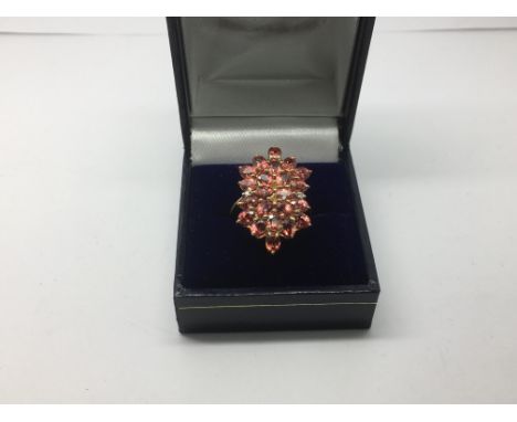 A 9ct gold, ruby and diamond cluster ring, approx 3.9g and approx size M.