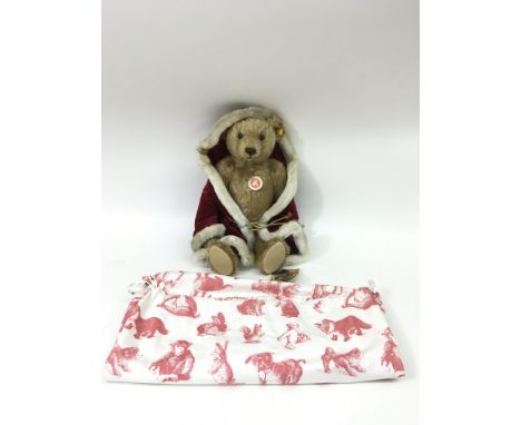 A Steiff, 2005 'Christmas' bear dressed in red robe with dustbag. Approx 36cm.