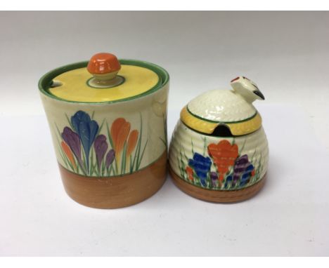 Two Clarice Cliff preserve pots decorated with crocus pattern