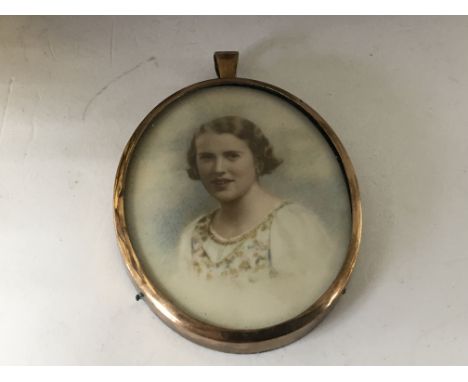 A 19th Century portrait watercolour miniature depicting a young girl in a floral pattern embroidered blouse 6.5cm.