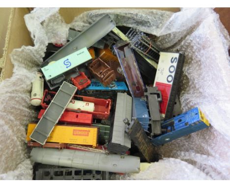 Three boxes of model train ephemera, box one with two controllers, track and forty-six assorted body shells of coaches and ro