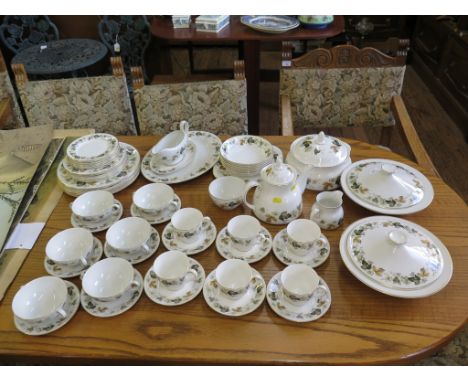 A Royal Doulton Larchmont pattern tea and dinner service, including three tureens, teapot and sauceboat (58 pieces)