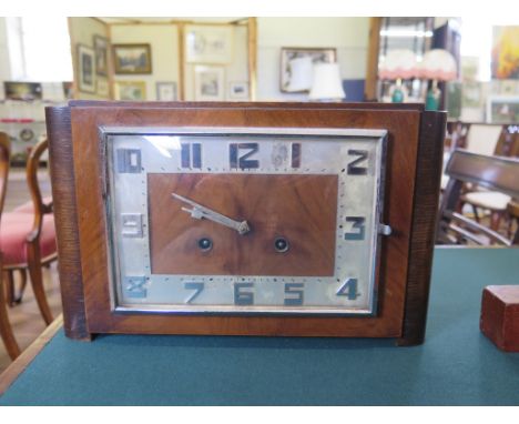 An Art Deco style oak mantel clock, of rectangular form with chrome numerals, the twin train movement striking on a gong 33cm
