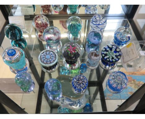 Sixteen glass paperweights, mostly Caithness, also Liskeard, Isle of Wight and Langham