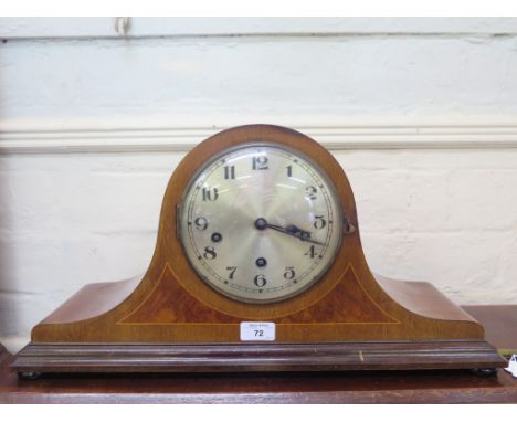 A 1930s inlaid walnut admiral hat mantel clock, the silvered dial with three train movement striking on gongs