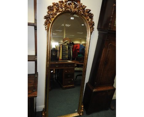 A reproduction gilt framed dressing mirror with foliate bracket surmount, 181cm high