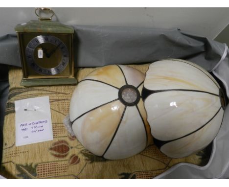 A set of patterned curtains, an onyx mantel clock, railway station print, modern glass Tiffany style lamp shades and fittings