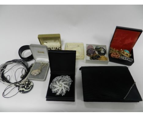 A large collection of costume jewellery; to include; simulated and freshwater pearls, a white metal hinged bangle, brooches e