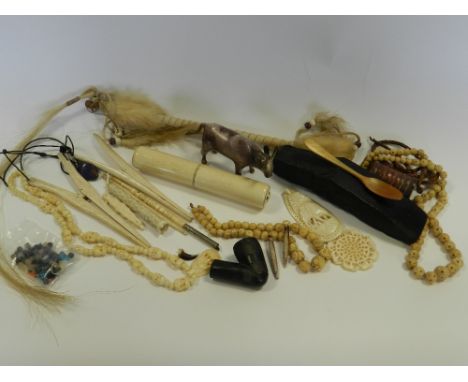 A mixed collectors lot, to include; a Polynesian type axe head, an African pipe bowl, a native America dance wand, a North Af