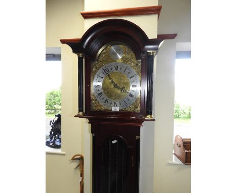 A reproduction three train longcase clock with glass door, silvered dial and marker Tempest Fugit in the arch, Roman numerals