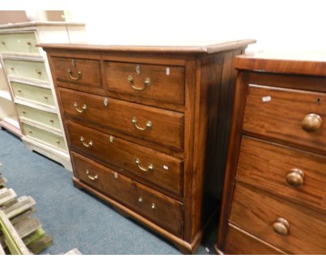 A 19th century oak chest of two short over three long drawers raised on short bracket feet