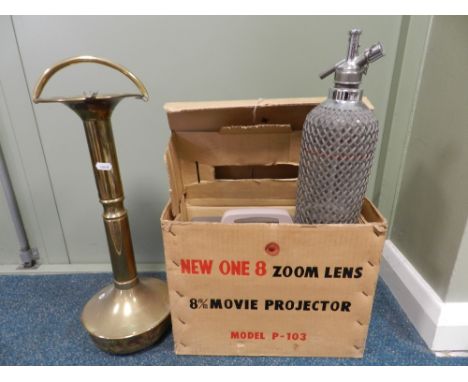 A box containing an 8mm movie projector, a brass ash tray on stand and a soda siphon 