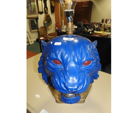 A cast plaster table lamp in the form of a tiger's head, painted blue and a modern tripod lamp standard 