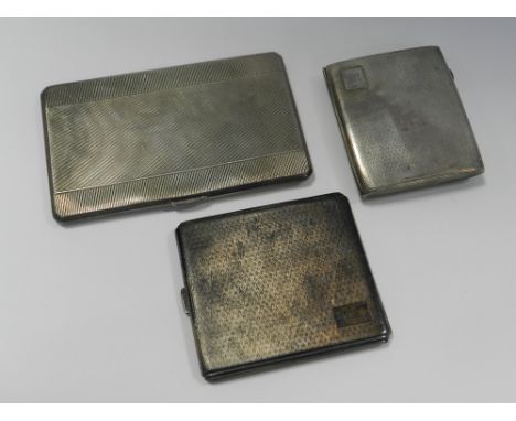 Three engine turned silver cigarette cases