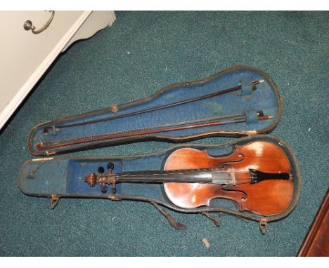 A cased violin with label marked 'Copie de Antonius Stradivarius Chromonencis ano 1721 and two bows stamped 'Czechoslovakia' 