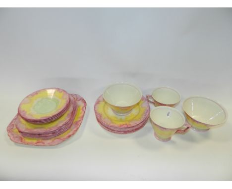 A Hancocks ivory ware part tea service in bright Art Deco colours