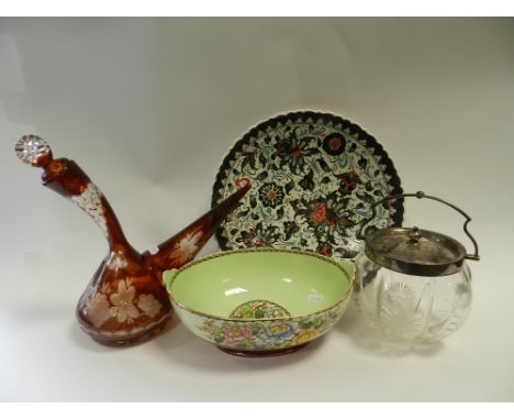 Three trays of decorative ceramics including a coloured glass Bohemian type liqueur decanter, Iznik tourist dish, wall plates