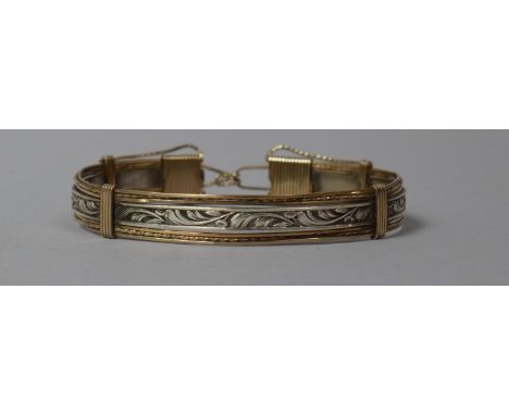 A Silver and Yellow Metal Bangle Stamped Silver 