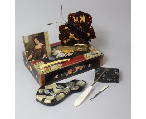 A Lacquered Papier Mache Box Containing Sundries to Include Nutcracker, Penknife, Button Hooks, Miniature etc 