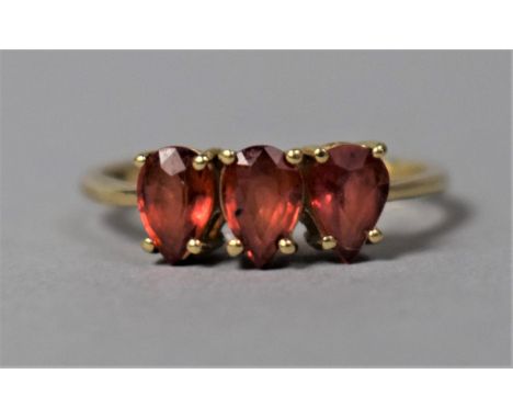 A 9ct Gold Tear Dropped Shaped Ruby Mounted Three Stone dress Ring, Size N 2g 