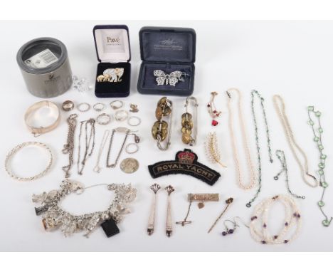 A selection of silver jewellery, including a part silver charm bracelet, chains, rings, bangles, with some costume jewellery,